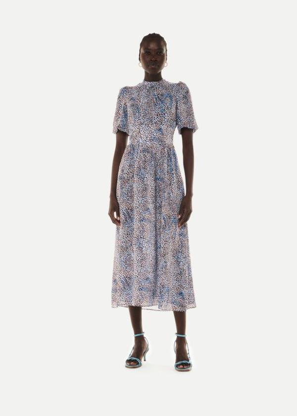 Person wearing a printed midi dress