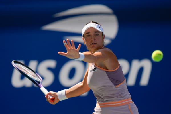 Caroline Dolehide of the United States returning a shot to Danielle Collins during the first round of the U.S. Open tennis championships in New York, 2024