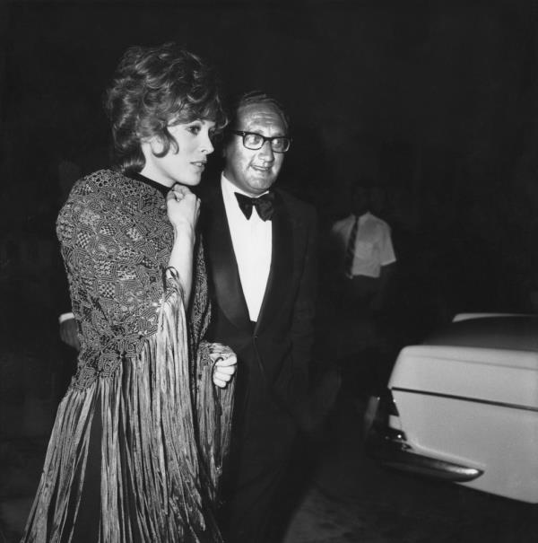 American diplomat Henry Kissinger and actress Jill St. John attend a party in 1970.