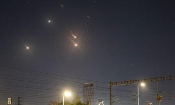 Projectiles apparently being intercepted by Israel above Tel Aviv.