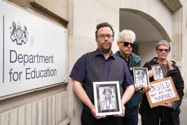 Members of teachers union Unison stand outside the Department for Education