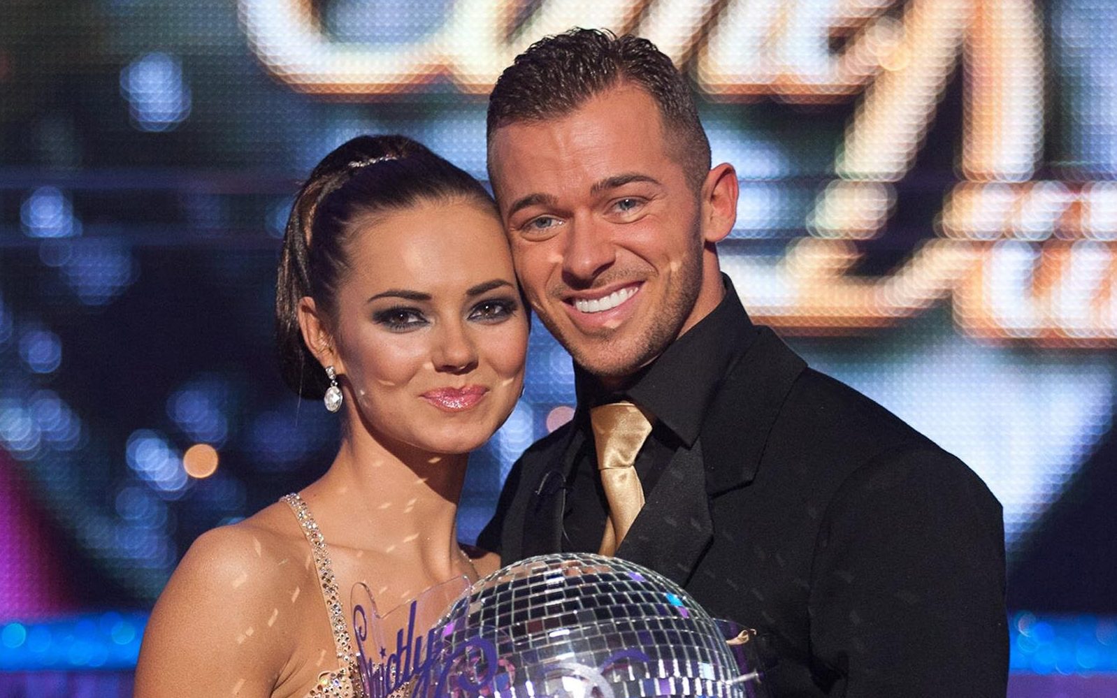 Strictly Come Dancing with Kara Tointon and Artem Chigvintsev holding the glitterball trophy