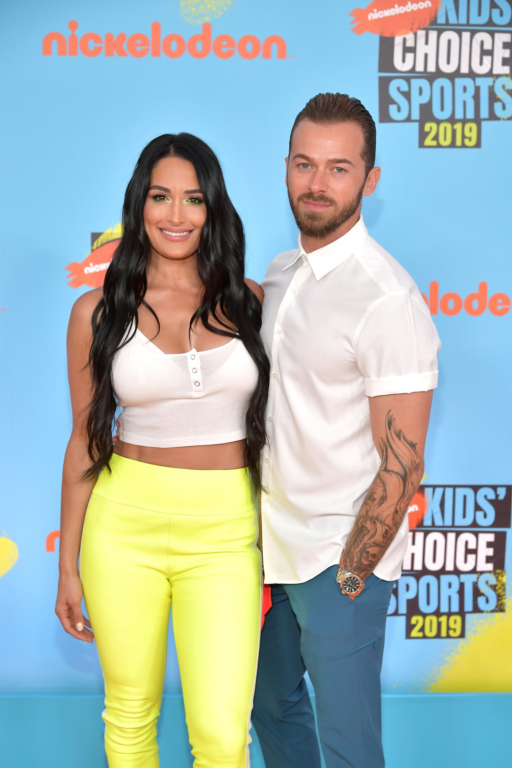 Nikki Bella and Artem Chigvintsev attend Nickelodeon Kids' Choice Sports 2019