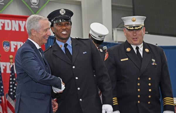 Navy veteran Darren Grant was promoted to lieutenant and said his mother inspired him to become a firefighter