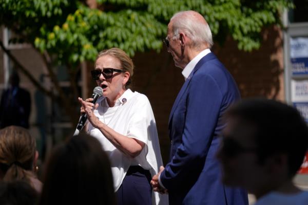 Rep. Madeleine Dean, D-Pa., speaks as President Joe Biden listens at a campaign rally in Harrisburg, Pa., on Sunday, July 7, 2024.