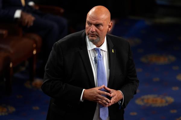 Sen. John Fetterman, D-Pa., wears a pendant in support of freeing hostages being held by Hamas home, before Israeli Prime Minister Benjamin Netanyahu speaks to a joint meeting of Congress at the Capitol in Washington, Wednesday, July 24, 2024.