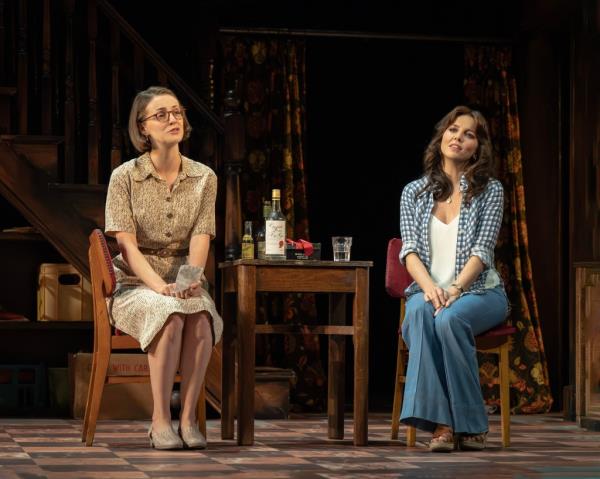 Jill (Helena Wilson) and Ruby (Ophelia Lovibond) sitting at a table