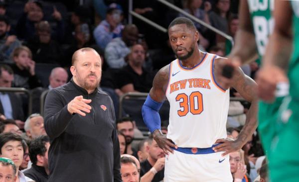nicks head coach Tom Thibodeau speaks with forward Julius Randle #30 on the sideline.