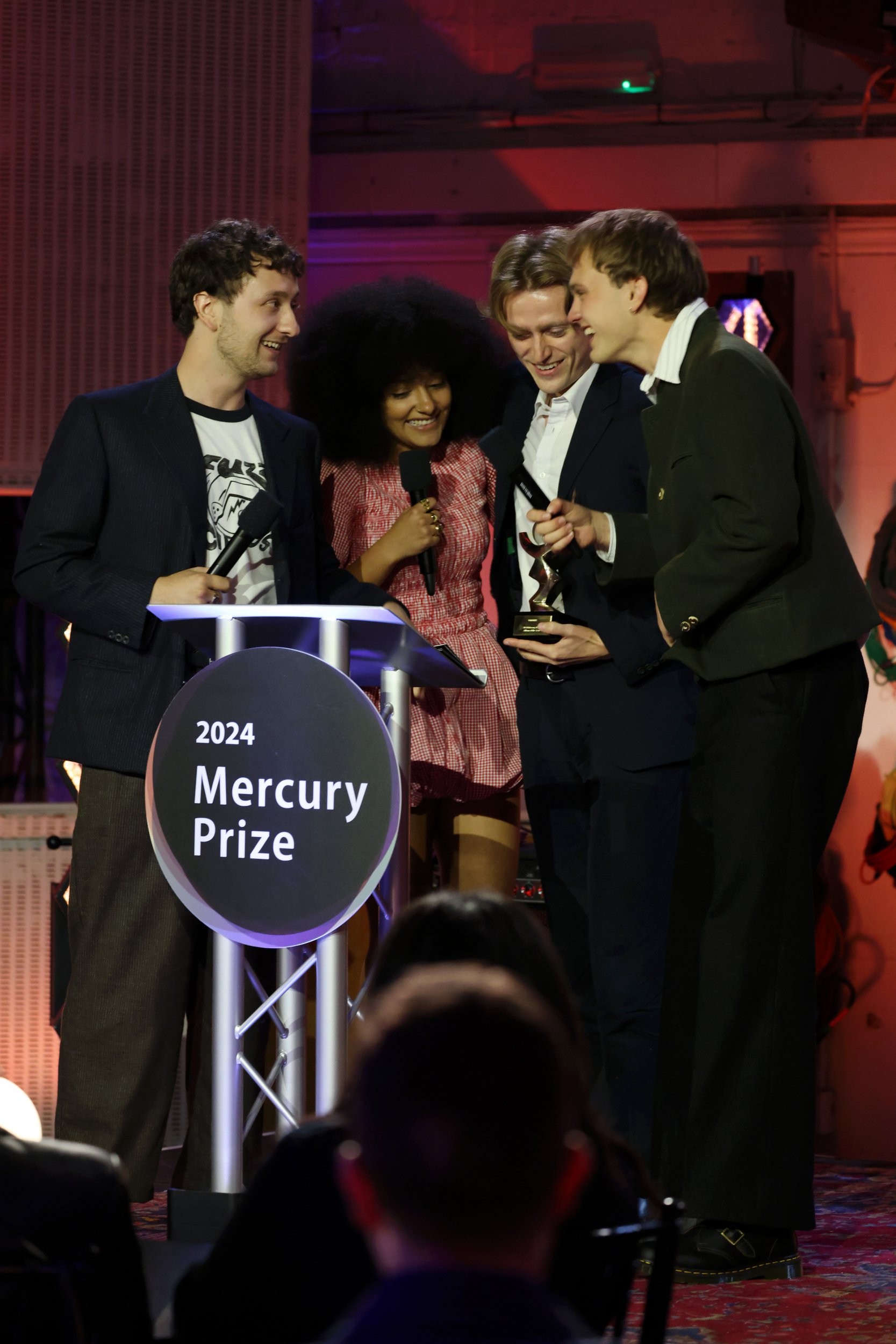 Lewis Whiting, Lily Fontaine, Nicholas Eden and Douglas Frost of English Teacher onstage after winning the Mercury Music Prize at the Mercury Music Awards 2024 at Abbey Road Studios on September 05, 2024