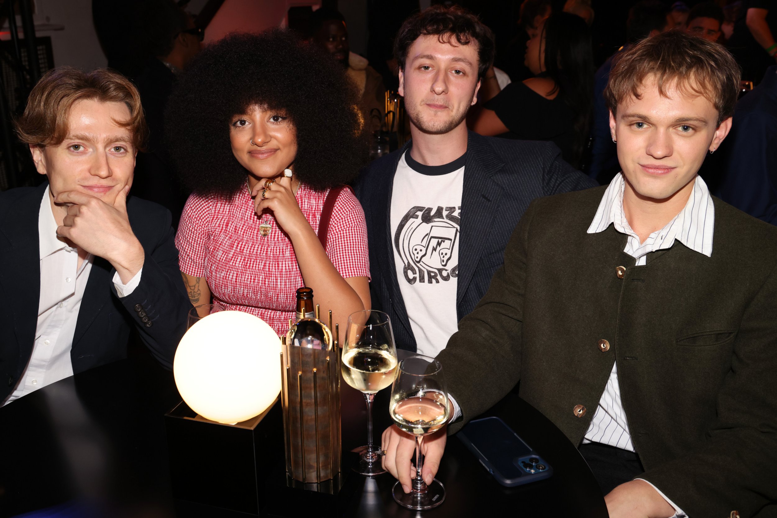 (L to R) Nicholas Eden, Lily Fontaine, Lewis Whiting and Douglas Frost of English Teacher smile while sat at table at the Mercury Music Awards 2024