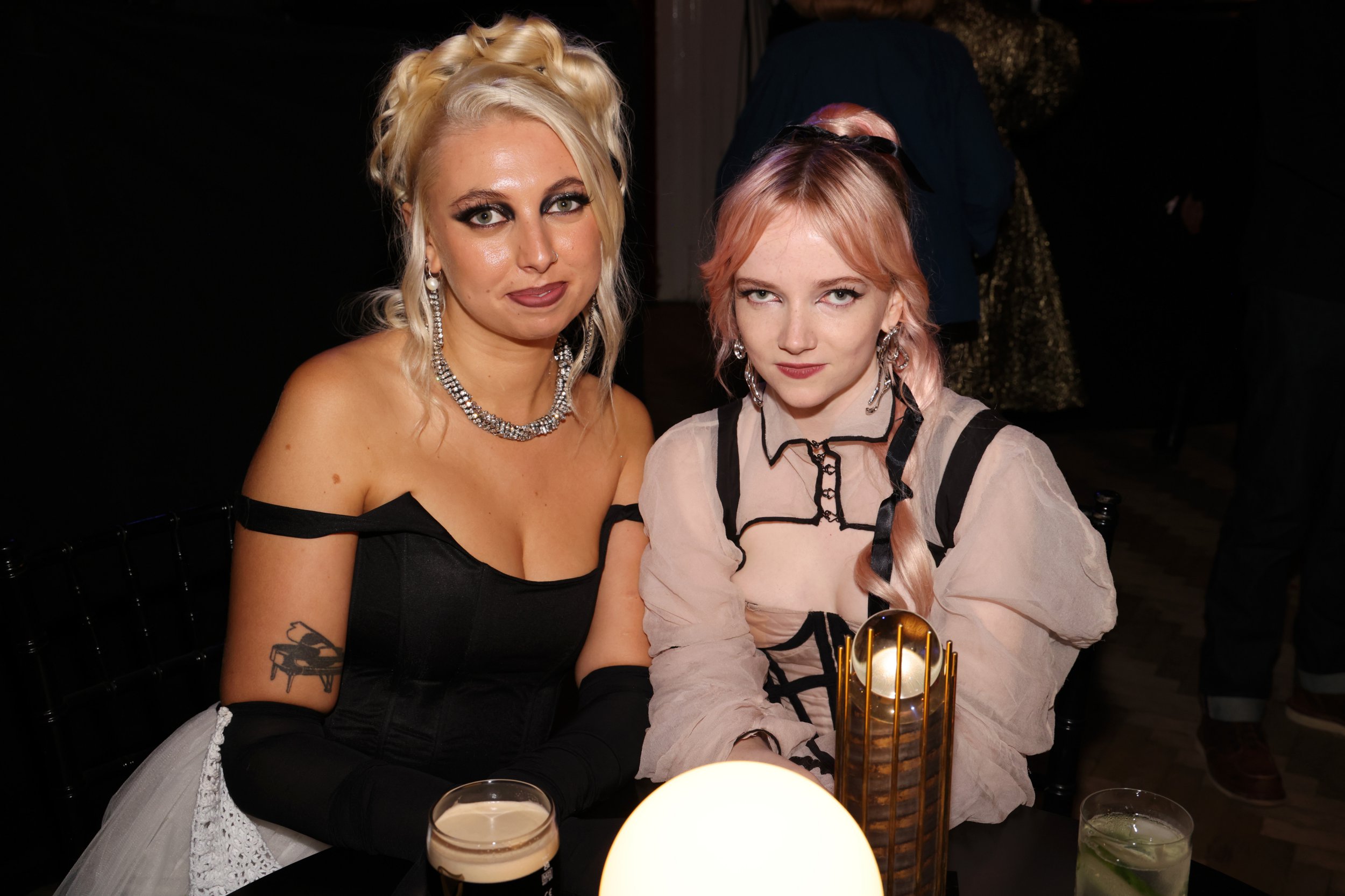 Emily Roberts and Georgia Davies of The Last Dinner Party pose together as they arrive at Mercury Music Prize Awards