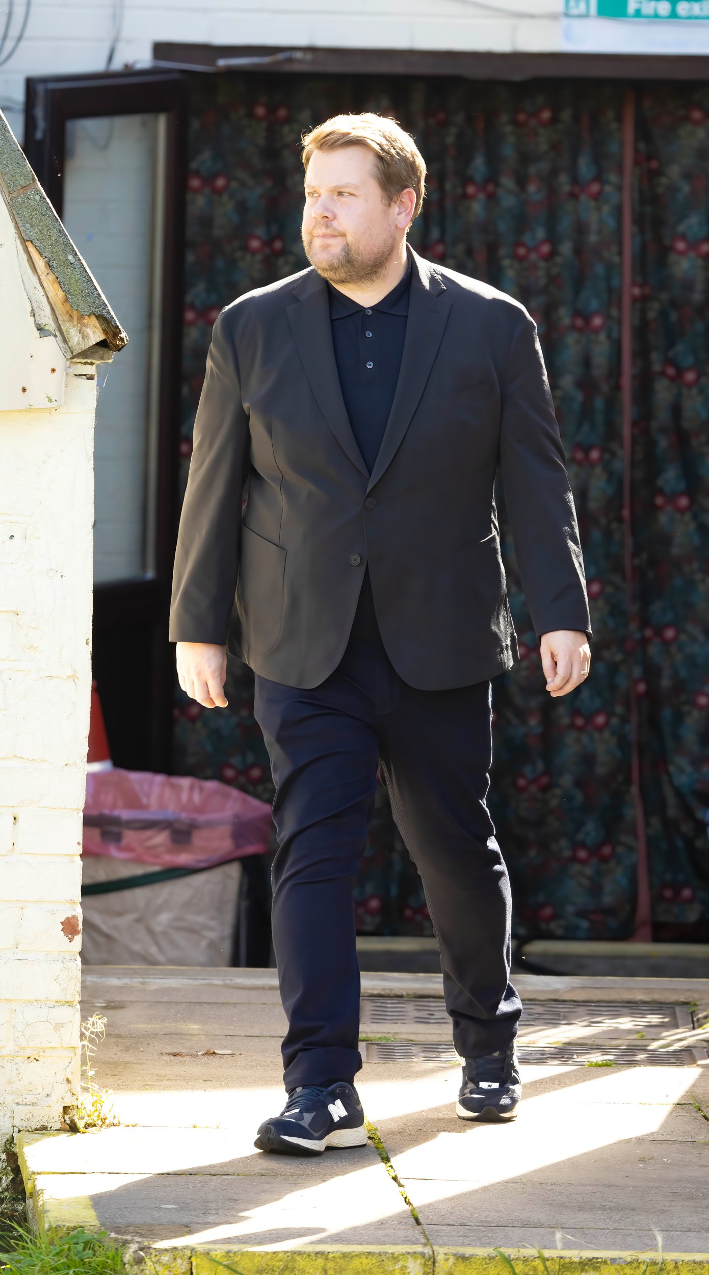James Corden as Smithy wearing a suit on the Gavin and Stacey set