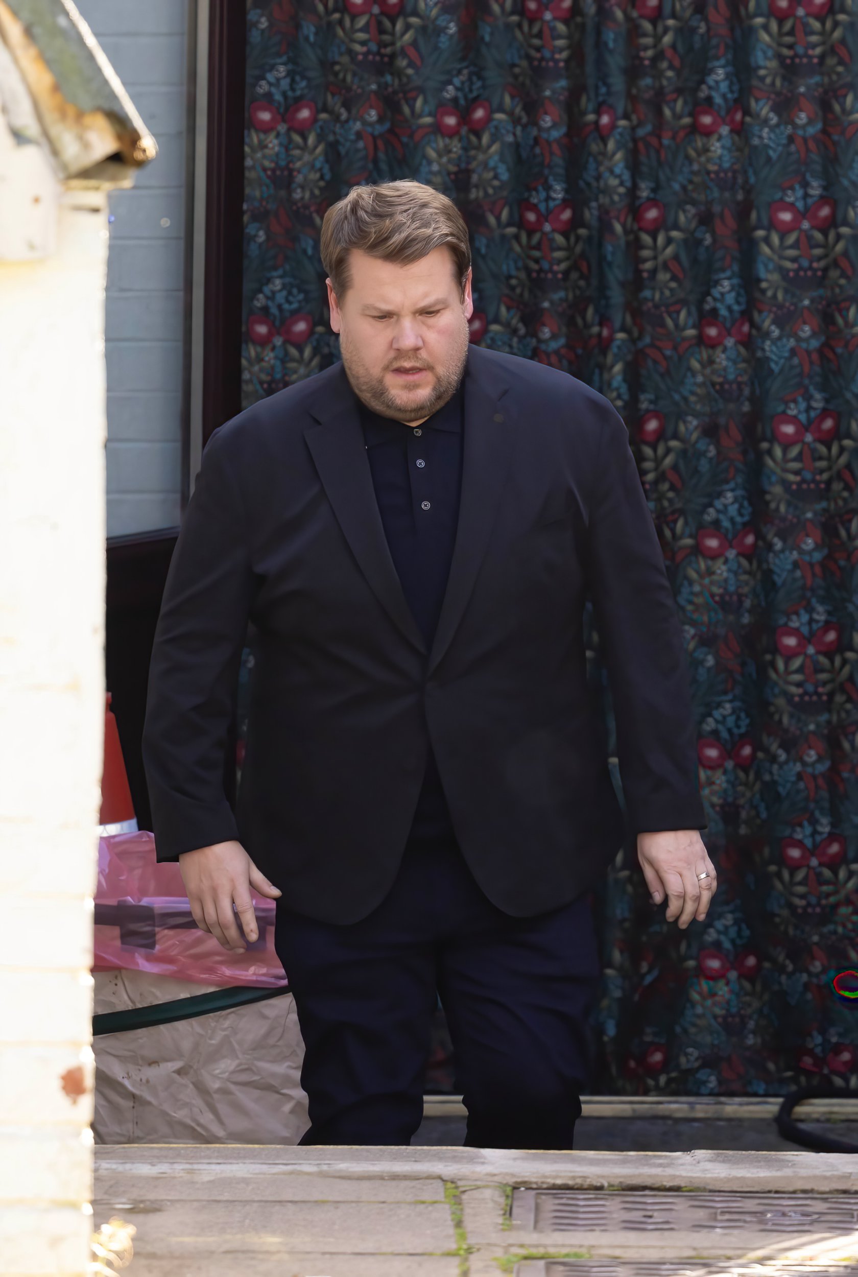 James Corden as Smithy wearing a suit on the Gavin and Stacey set