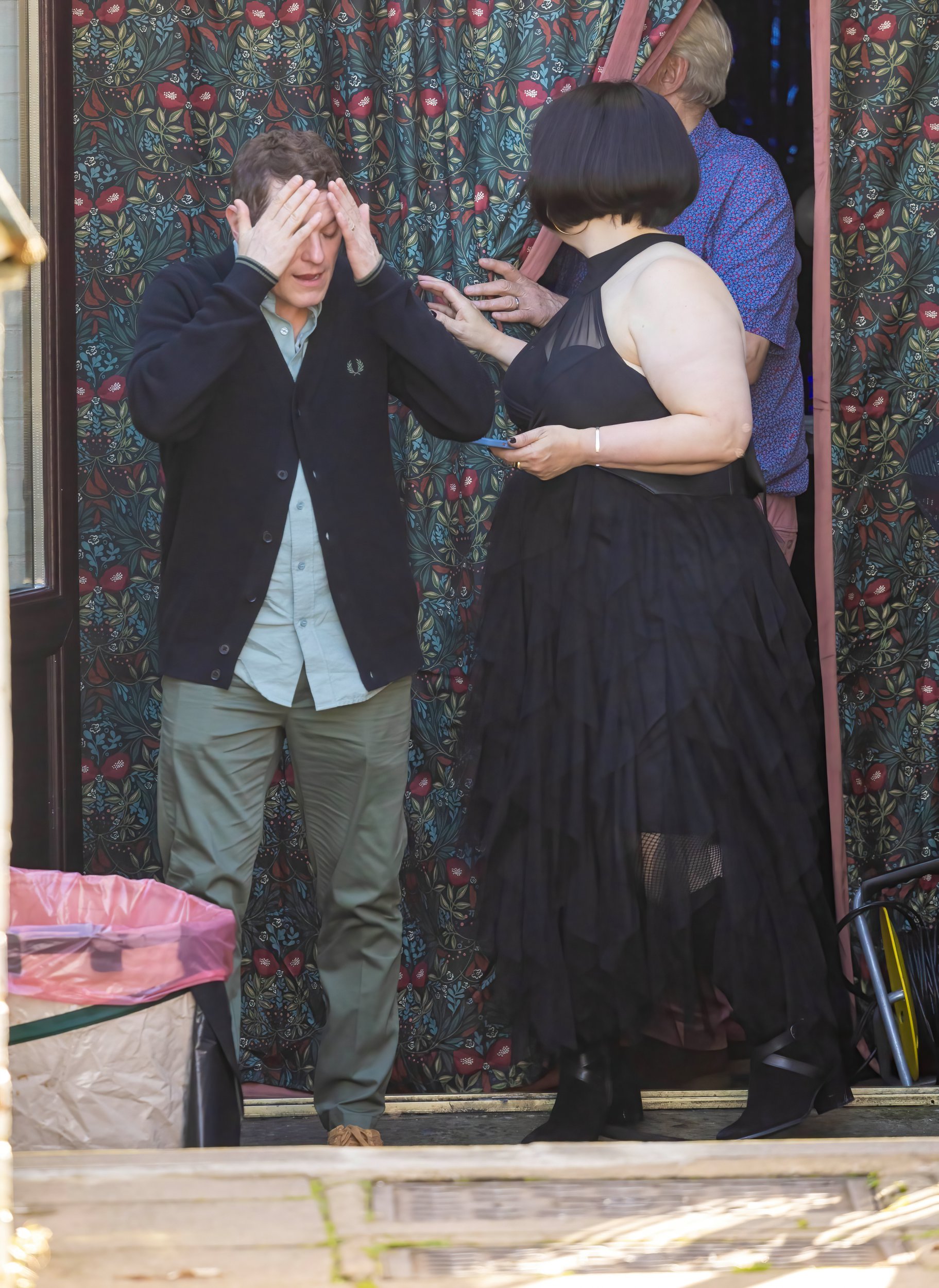 Mathew Horne as Gavin putting hands on his head and Ruth Jones as Nessa on the Gavin and Stacey set