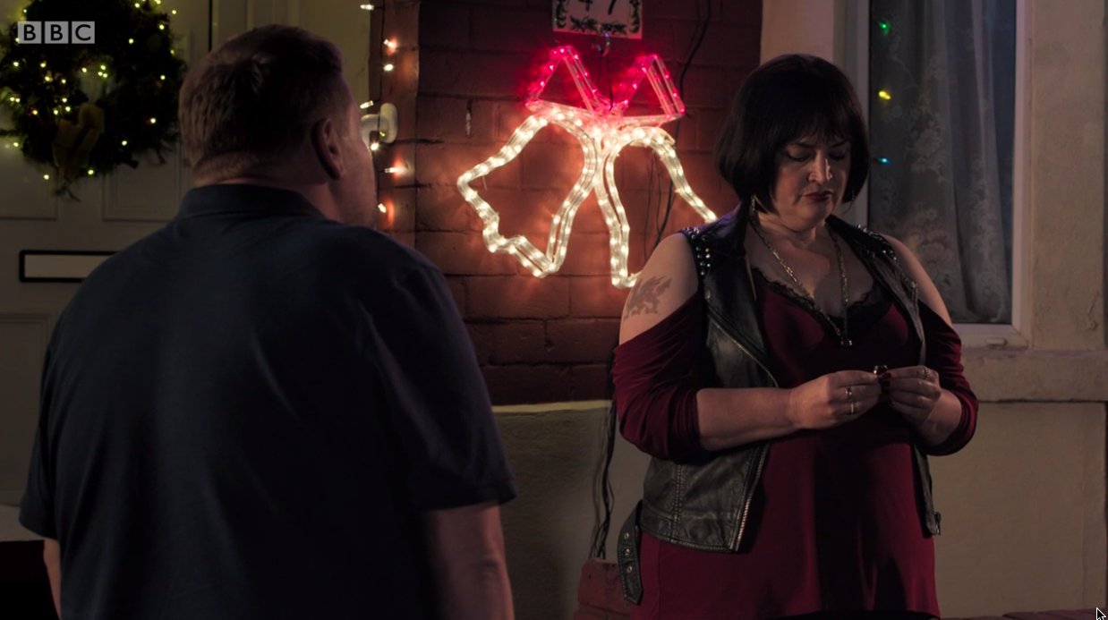 Ruth Jones as Nessa holding an engagement ring in front of James Corden as Smithy on an episode of Gavin and Stacey
