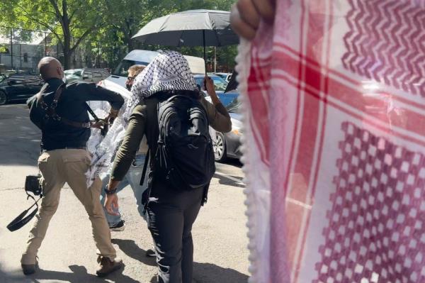 Anti-Israeli protesters attack a phogorapher.