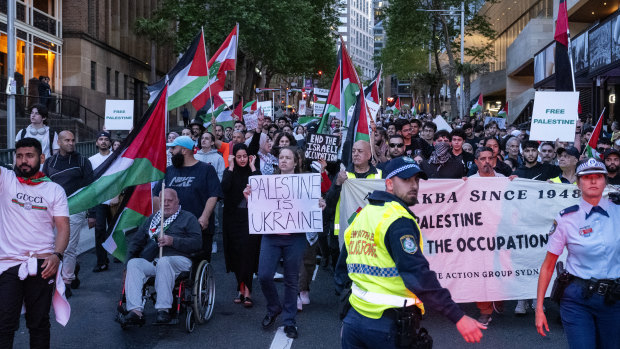 Pro-Palestinian protesters march through Sydney on Monday. Activists  will defy warnings from NSW Police and rally again in Sydney’s Hyde Park on the weekend.