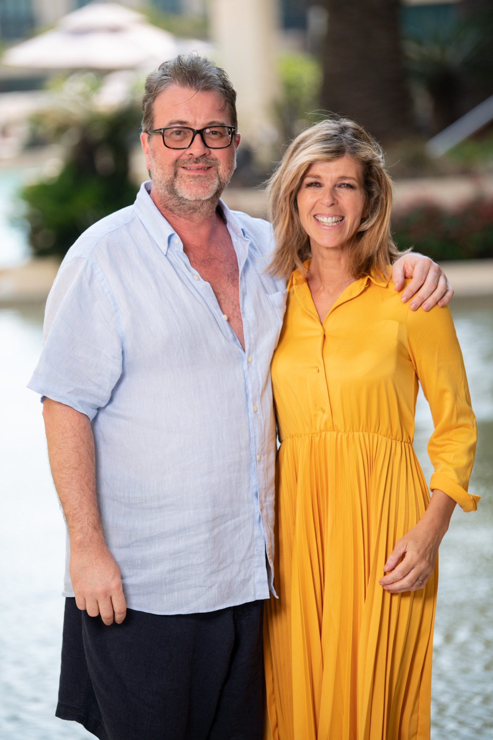 Derek Draper has his arm wrapped around Kate Garraway's shoulders as they pose for a photo