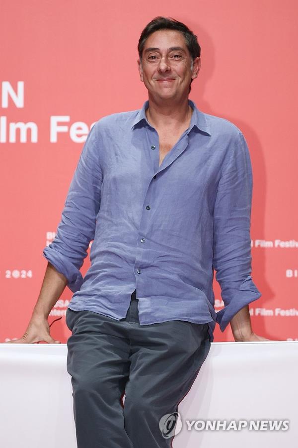 Portuguese film director Miguel Gomes poses for photos after a press conference at the Busan International Film Festival in the southeastern city of Busan on Oct. 4, 2024. (Yonhap)