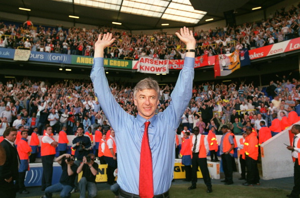 Manager Arsene Wenger celebrates Arsenal winning the Premier League after the match between Tottenham and Arsenal at White Hart Lane
