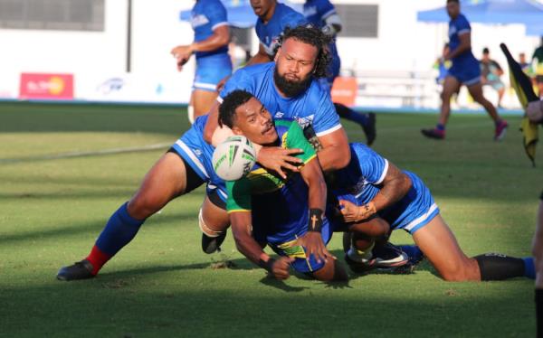 Big Hits - Samoa put in some bone-crunching tackles against hosts Solomon Islands. FT score Samoa - Solomons Islands. FT score Samoa 22 - 4 Solomon Islands.