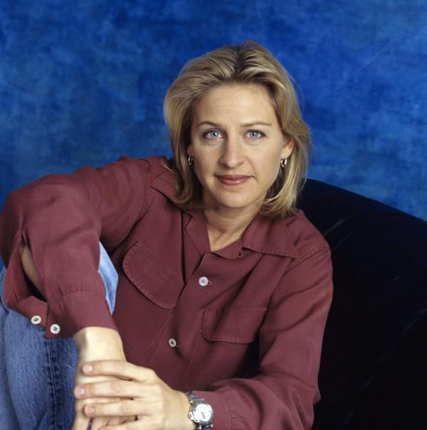 Ellen DeGeneres sitting on a couch during a 1993 cast gallery shoot for 'These Friends of Mine'