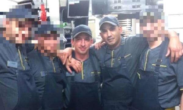 Pavel (left) and Roman (right) with other McDonald's employees.