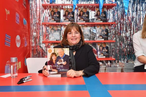 Ina Garten signs cookbooks during the Food Network's rooftop birthday party hosted by Alton Brown, Giada De Laurentiis, Bobby Flay and Ina Garten at Pier 92 on October 13, 2018.
