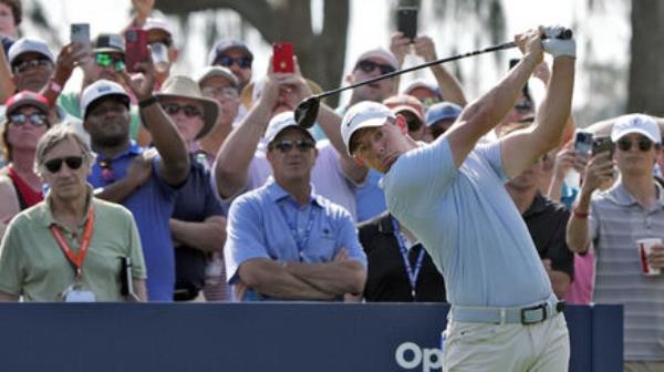 Rory McIlroy, of Northern Ireland, hits his tee shot in front of the gallery on the 10th hole during the second round of The Players Championship golf tournament Friday, March 15, 2024, in Ponte Vedra Beach, Fla. (AP Photo/Lynne Sladky) Rory McIlroy, of Northern Ireland, hits his tee shot in front of the gallery on the 10th hole during the second round of The Players Championship golf tournament Friday, March 15, 2024, in Ponte Vedra Beach, Fla. (AP Photo/Lynne Sladky)