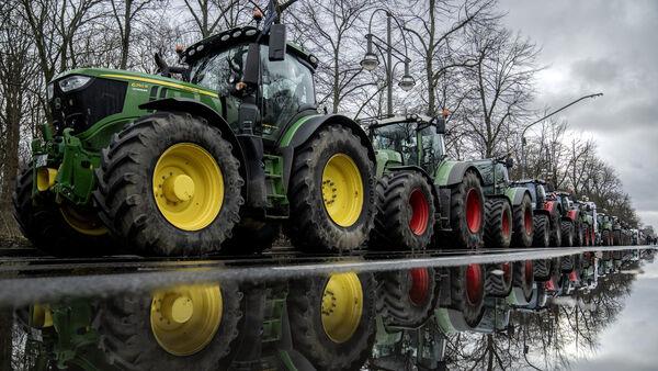 Farmers drive thousands of tractors into Berlin in fuel subsidy cuts protest