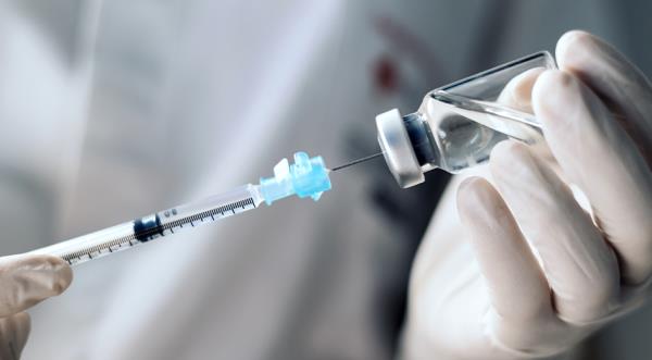 Needle going into vial