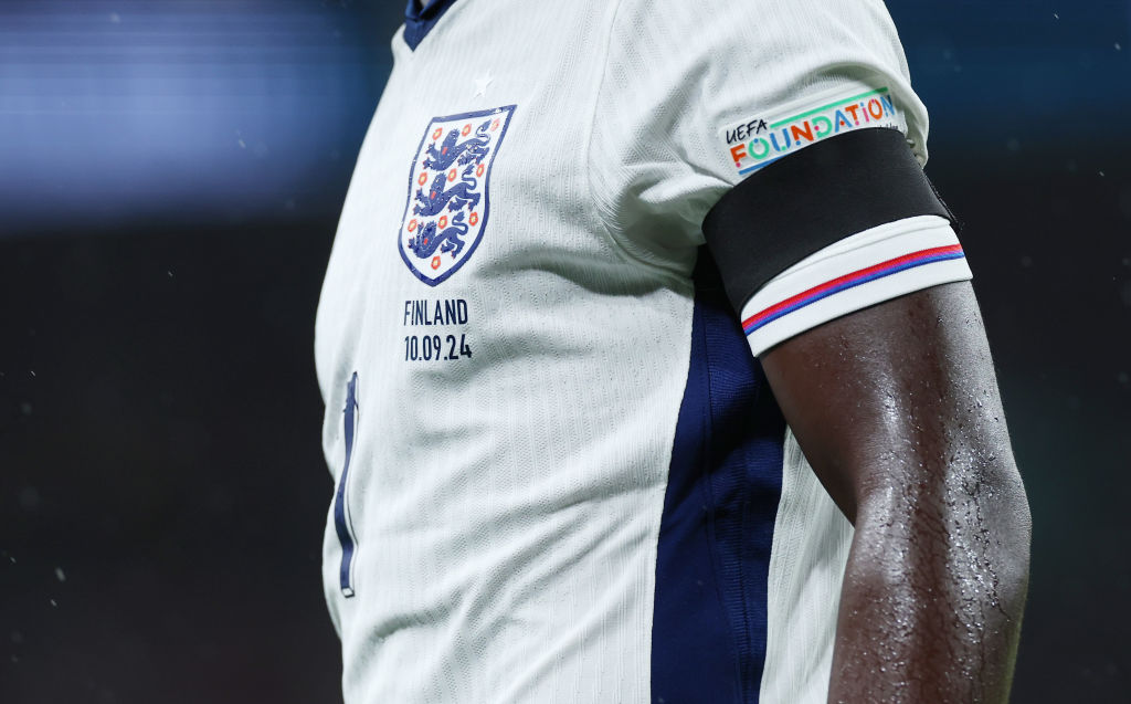 An England shirt with a black armband on its sleeve.
