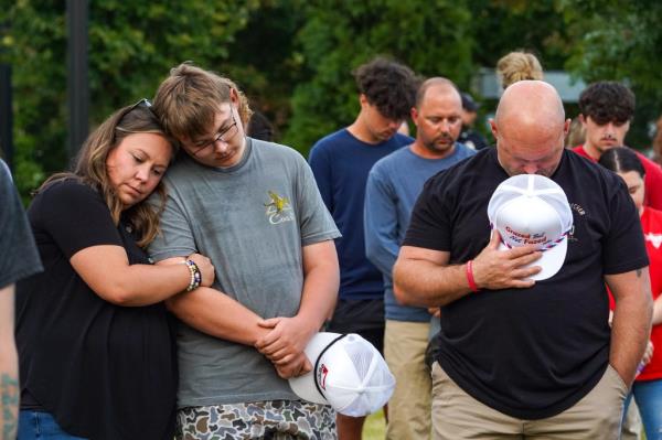 Community members gathering for a vigil at Apalachee High School after a tragic shooting event in Winder, Georgia, September 4, 2024