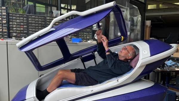 FILE - Australian euthanasia advocate Philip Nitschke demonstrates the Sarco assisted suicide capsule during a press conference organized by The Last Resort, a human rights group focused on assisted suicide, in Zurich, Switzerland, on July 17, 2024.