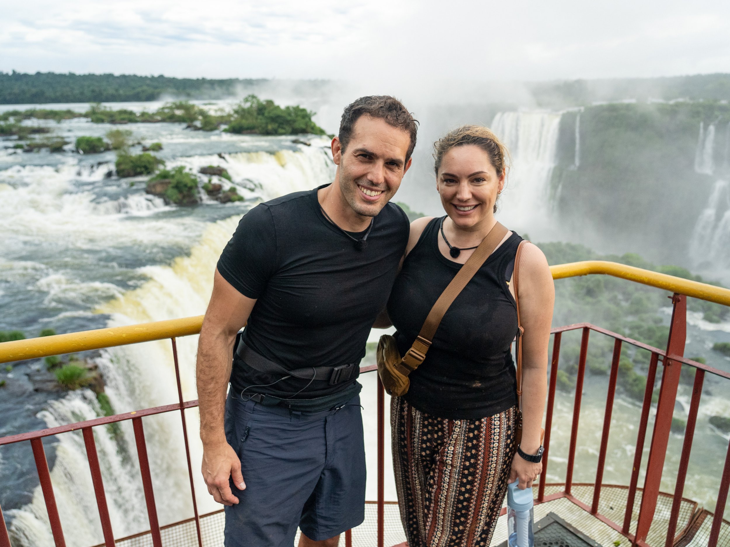 Kelly Brook and Jeremy Parisi in front of a waterfall during Celebrity Race Across The World