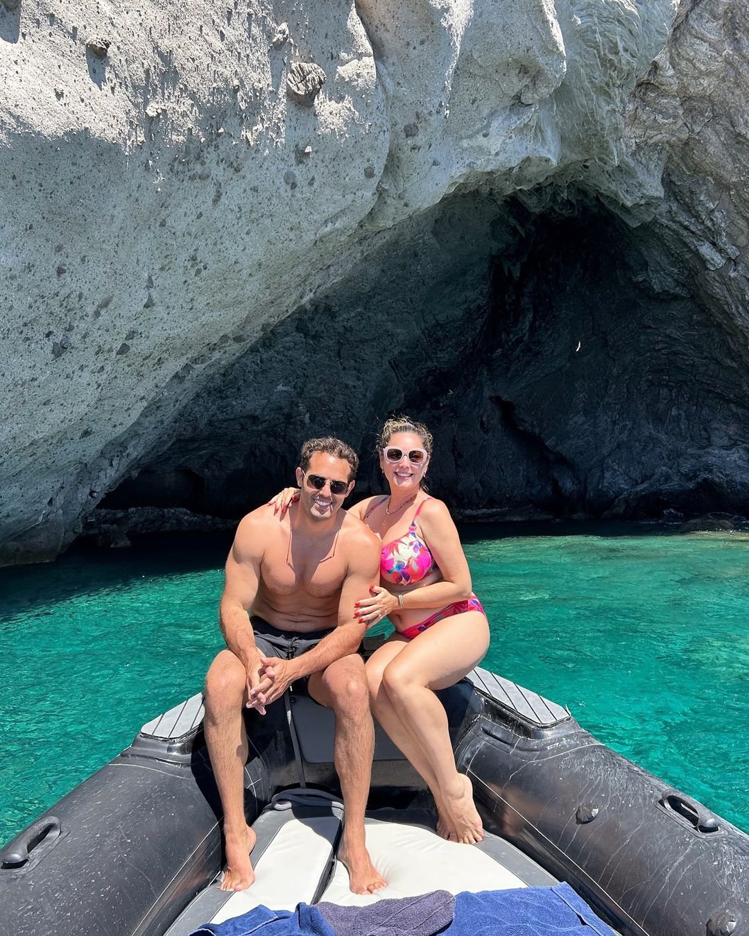 Kelly Brook and Jeremy Parisi sit on a boat