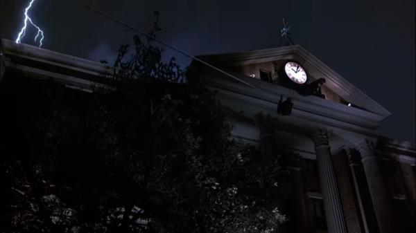 Stuntman rappelling down from a clock tower, doubling for Dr. Emmett Brown in the iconic scene from Back To The Future.