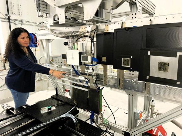 ORNL neutron scattering scientist Hassina Bilheux points to equipment inside VENUS. Credit: Sumner Brown Gibbs/ORNL, U.S. Dept. of Energy