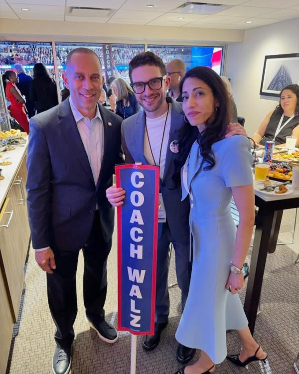 Congressman Hakeem Jeffries, Alex Soros, and Huma Abedin posing for a photo at the Democratic National Convention in Chicago, IL.