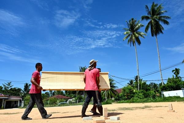 The final gift: An elderly man and his sons make free coffins to bring comfort to their community in Terengganu