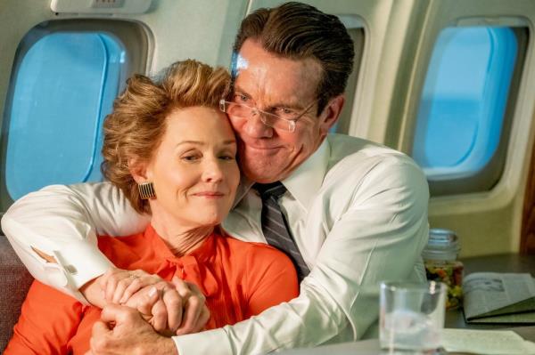Dennis Quaid and Penelope Ann Miller in a scene from the film 'Reagan', hugging on an airplane