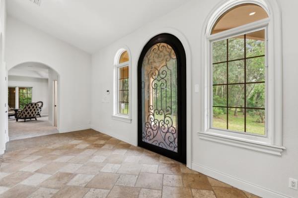The home features lovely arched details