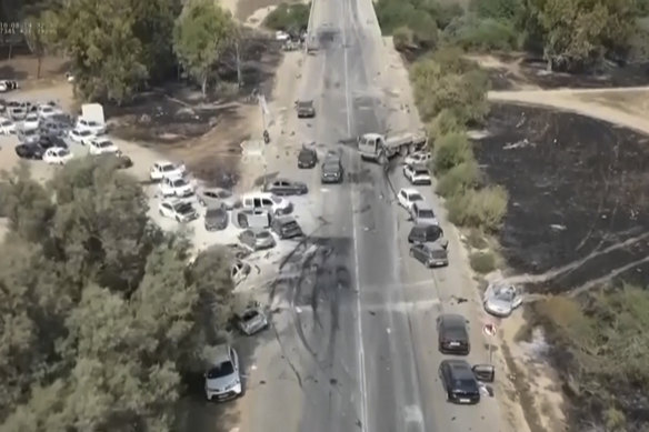 Charred and damaged cars at the exit of the Tribe of Nova trance music festival road after an attack by Hamas militants in southern Israel on Saturday.