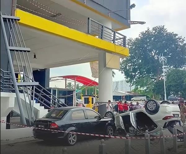 Driver suffers head injuries as car plunges from Seremban Terminal One parking lot onto another vehicle