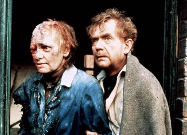 Two characters from the film Threads - one with a facial deformity 