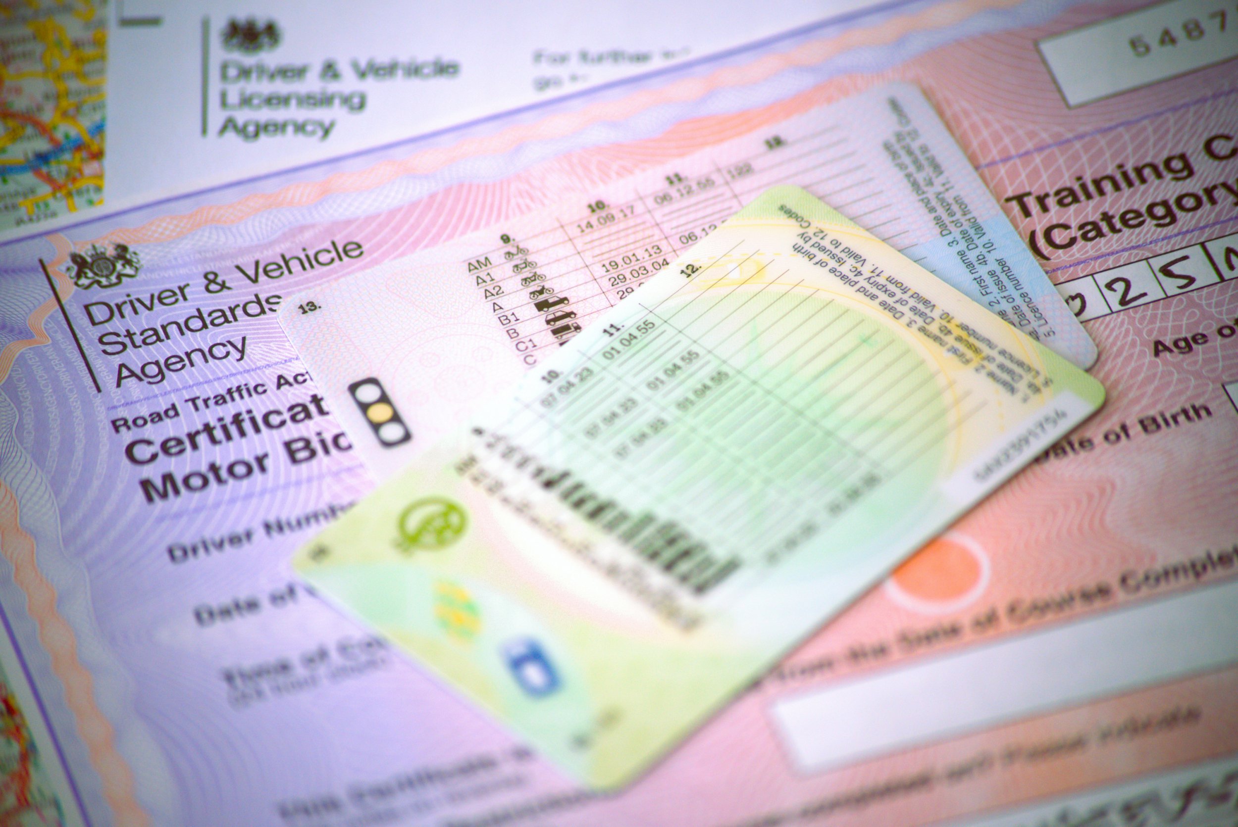 DVLA application and driving licence on a table. 