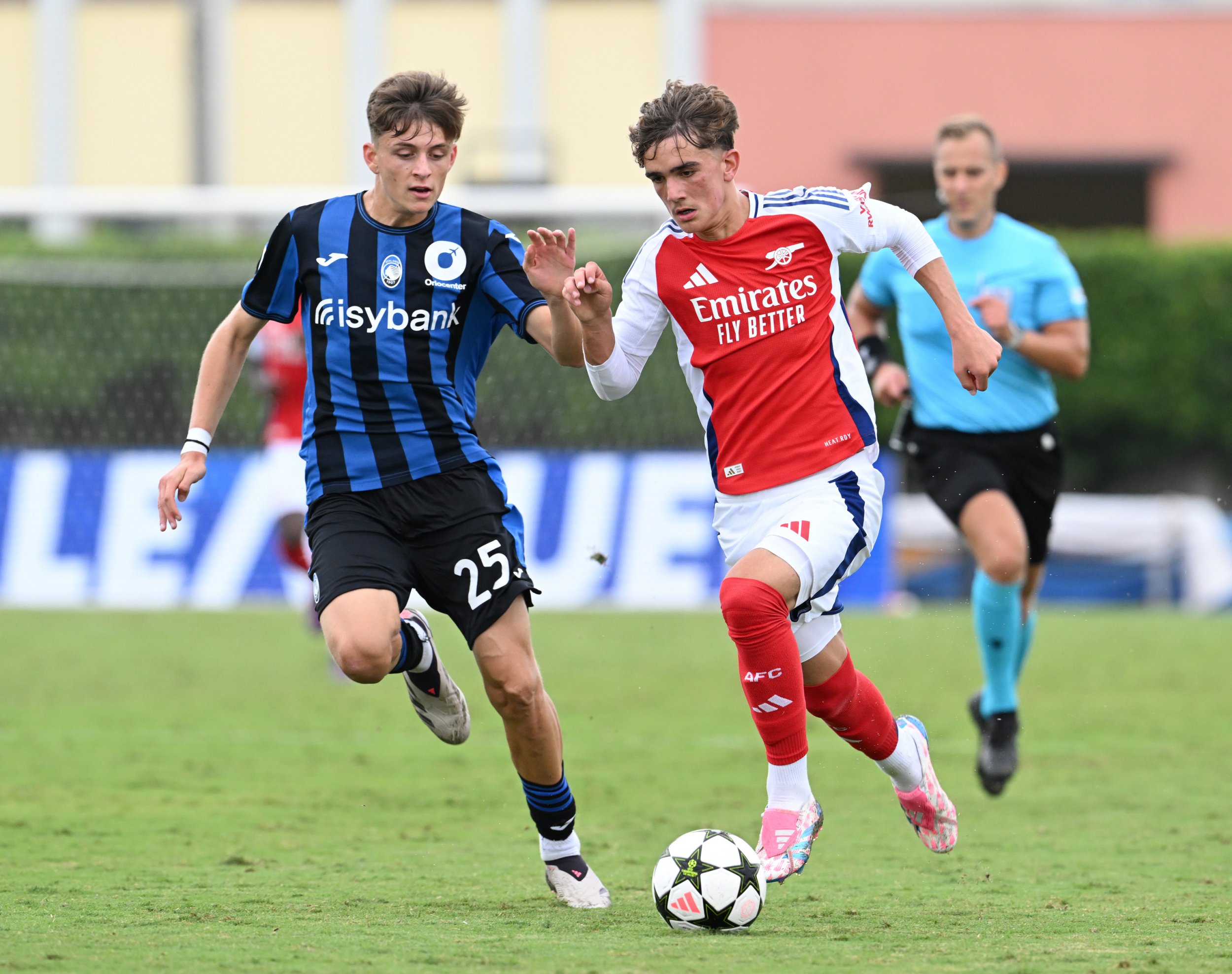 Max Dowman of Arsenal takes on Federico Steffanoni of Atalanta during the UEFA Youth League match between Atalanta BC U19 and Arsenal U19 at Stadio Comunale di Caravaggio on September 19, 2024 in Caravaggio, Italy.