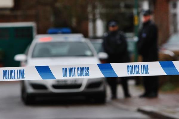 Police tape blurred