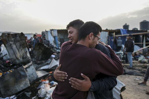 Palestinians react next to the destruction after an Israeli strike where displaced people were staying in Rafah, Picture: Jehad Alshrafi Palestinians react next to the destruction after an Israeli strike where displaced people were staying in Rafah, Picture: Jehad Alshrafi