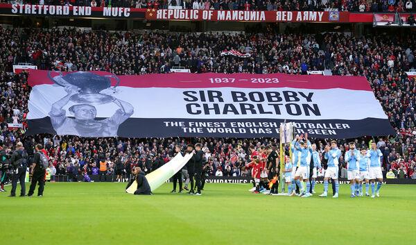 A giant banner in tribute to Bobby Charlton during the Premier League match at Old Trafford, Manchester. Picture date: Sunday October 29, 2023. A giant banner in tribute to Bobby Charlton during the Premier League match at Old Trafford, Manchester. Picture date: Sunday October 29, 2023.